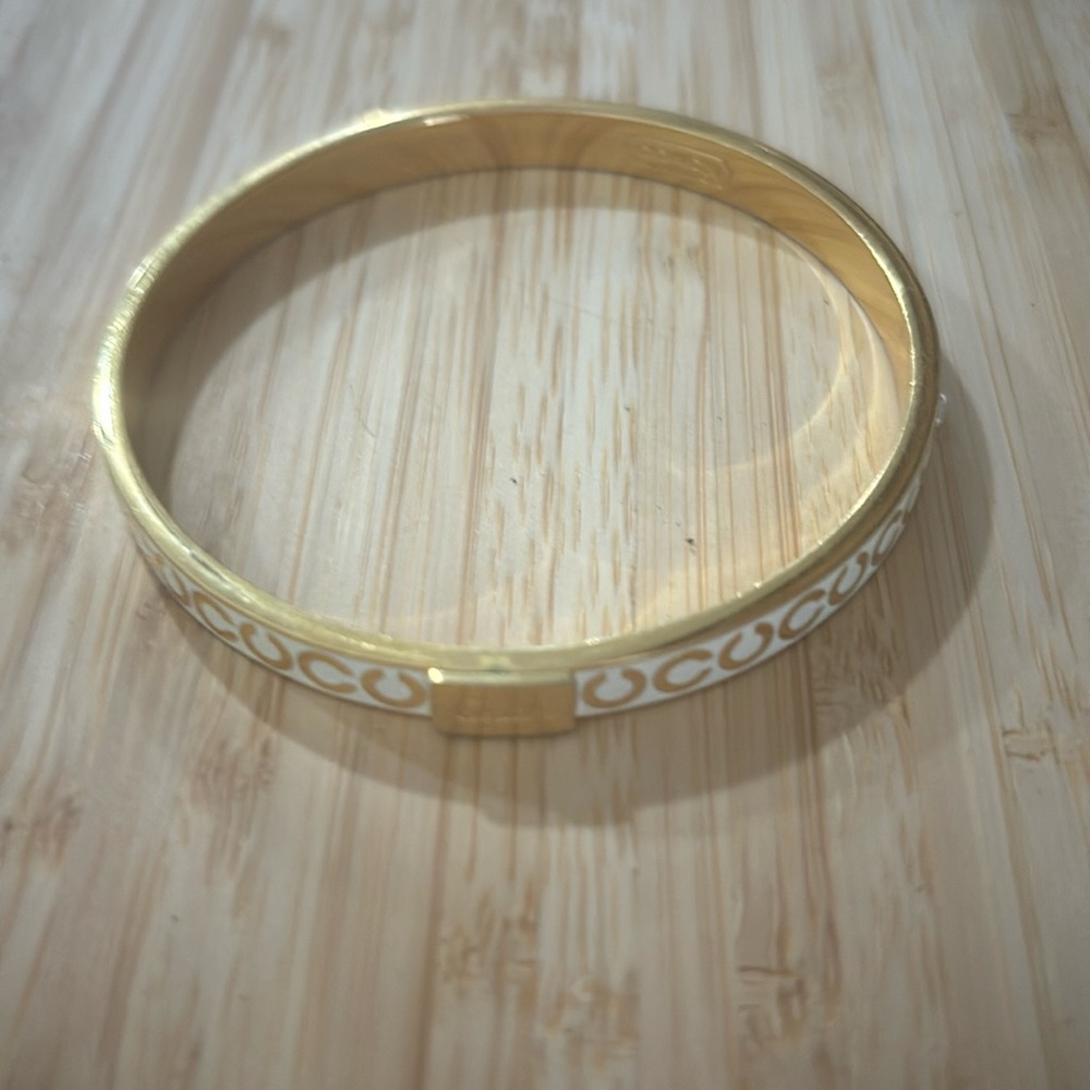 Early 2000’s   Coach cream and gold bracelet.